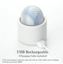 Tenga iroha Temari MIZU Vibrator charging in its holder with USB cable connection.