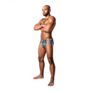 Model wearing Male Power Dirty Denim Print Thong Blue S/M, showcasing photorealistic denim jean print.