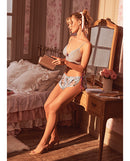 Lace Bralette with Satin Floral Shorts Silver Bloom S/M displayed in a cozy room setting, showcasing its delicate lace and floral design.