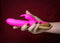 Maia Toys rechargeable silicone rabbit vibrator in pink, featuring rotating beads and clitoral stimulator.