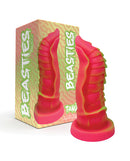 Nobu Tanu Fantasy Dong Fluorescent Pink beside packaging, showcasing its vibrant colors and sculpted design.