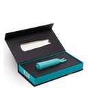 NU Sensuelle Rabbit Vibe Bunnii Blue in open packaging showcasing its compact design and vibrant color.