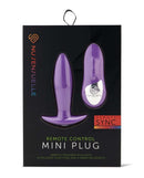 NU Sensuelle Remote Control Mini Butt Plug Purple packaging showcasing the product and remote control for enhanced pleasure.