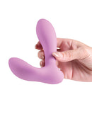 Love Notes Obsidian App Controlled Butt Plug Mauve held in hand, showcasing the sleek silicone design in soft mauve shade.