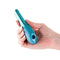 Person holding the Seduction Nuvo Metallic Teal mini vibe with air pulse stimulator, featuring a sleek metallic handle.