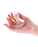 Cosmic Glams Small Silicone Butt Plug Rainbow held in hand showcasing its dazzling design.