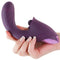 Inya Caprice Purple vibrator with thrusting and percussive vibrations for G-Spot and clitoral stimulation, held in a hand.