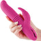 Inya Passion Pink rabbit vibrator with thrusting, expanding, and vibrating features held in hand.