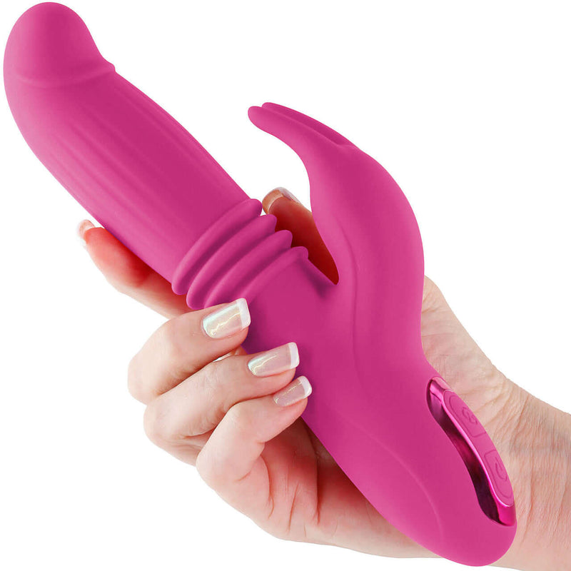 Inya Passion Pink rabbit vibrator with thrusting, expanding, and vibrating features held in hand.