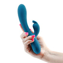 Inya Love Bunny Rechargeable Silicone Rabbit Vibrator Teal held in a hand, showcasing its sleek design and dual stimulation features.