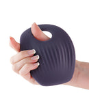 INYA Grinder App Controlled Grinding Vibrator Gray held in hand, showcasing its textured surface for enhanced grip.