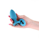 Inya Alpine 2.0 Rechargeable Anal Plug with Remote Control Teal held in a hand, showcasing its sleek design.