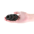 Renegade Fireman Rings 3 Pieces Black held in a hand, showcasing flexible silicone design for comfort and support.