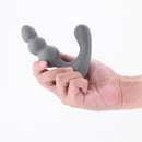 Renegade Triumph Silicone Vibrating Prostate Massager Grey held in hand showcasing its ergonomic design.