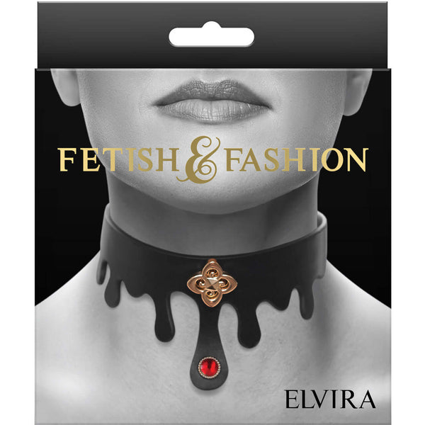 Elegant black bondage collar with gold charm and ruby jewel, presented by Fetish & Fashion - Elvira Collar in packaging