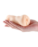 Barely Legal Christine Vagina Stroker White held in a hand, showcasing its compact, lifelike design for solo play.