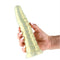 Hand holding the Fantasia Nymph Dildo Silicone in yellow, showcasing its flexible design and textured surface for enhanced pleasure.