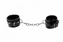 Ouch Leather Cuffs Black are durable black leather cuffs connected by a metal chain for bondage and secure restraint.