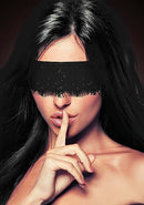 Ouch Mystere Lace Mask Black worn by a model, enhancing intimacy and allure with its seductive lace design.