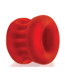 Oxballs UltraCore Ball Stretcher with Axis Ring Red Ice, a red silicone ball stretcher with ribbed design.