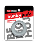 Hunky Junk Expander Slimmer Scoop Cockring Clear Steam displayed on packaging, featuring a sleek design and soft texture.