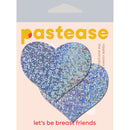 Pastease Hearts Silver Glitter Pasties in a stylish packaging with a playful slogan for bold fashion statement.