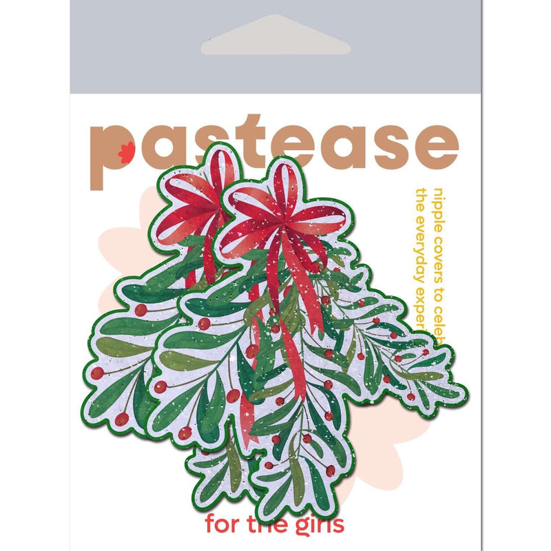 Christmas-themed mistletoe nipple pasties with red glitter bow by Pastease in packaging.