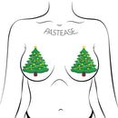 Green glitter Christmas tree nipple pasties by Pastease on illustration of a woman's chest.