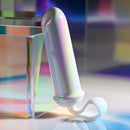 Playboy Orgasmic Fantasy Rechargeable Silicone Bullet in white and purple, featuring iridescent glow and finger loop for ease of use.