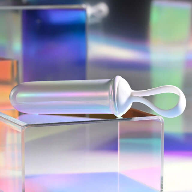 Playboy Orgasmic Fantasy Rechargeable Silicone Bullet in white and purple on iridescent background.