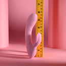 Playboy Rabbit Party Silicone Rabbit Vibrator Purple next to a ruler for size comparison.
