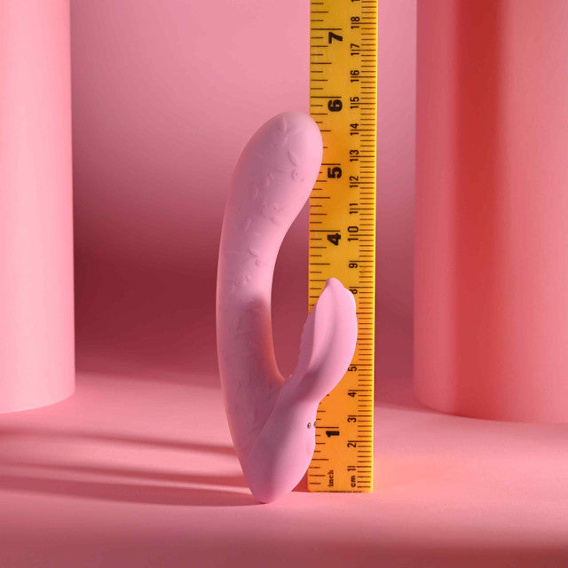 Playboy Rabbit Party Silicone Rabbit Vibrator Purple next to a ruler for size comparison.