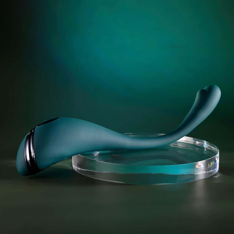 Playboy Pin Point Perfection Bendable Precision Vibrator on display against a green background.