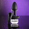 Playboy Rim Shot Rechargeable Silicone Anal Plug Black with remote control on a glittery background.