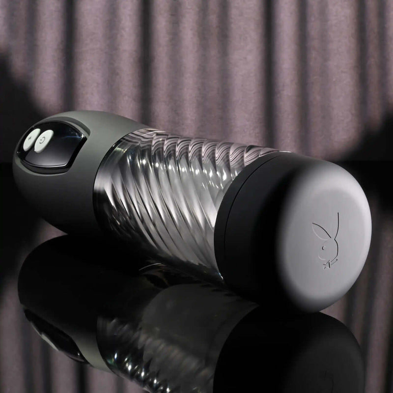 Playboy Whirlwind Stroker with clear spiral design and control buttons for customizable thrusting and spinning stimulation.