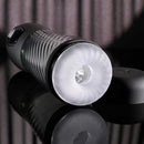 Playboy Whirlwind Stroker, thrusting and spinning masturbator with turbo mode on reflective surface, lid beside it.