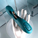 Playboy Aurelie green silicone G-Spot vibrator with rose gold trim on a hand, showcasing control buttons.