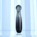 Playboy Bon Voyage Rechargeable Silicone Vibrator displayed on a reflective surface with elegant backdrop.
