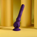 Playboy Wiggle It Rechargeable Wiggling Shaft Purple against a yellow backdrop, showcasing its unique design and color.