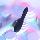 Playboy Overdrive Silicone Heating Vibrator Black displayed on a hand with colorful lighting effects.