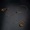 Pulling Chain Nipple Clamps made of zinc alloy and copper, featuring a decorative chain and elegant design for adjustable comfort.