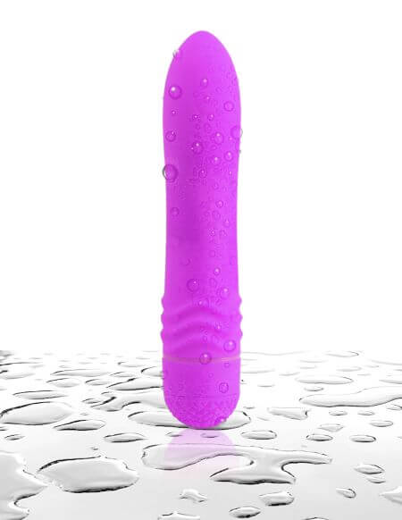 Neon Luv Touch Waves Purple Vibrator by Pipedream Products, waterproof multi-speed vibrator with wavy ribbed design on wet surface