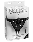 Fetish Fantasy Series Vibrating Plush Harness Black packaging, featuring adjustable strap-on design and included vibrating bullet.