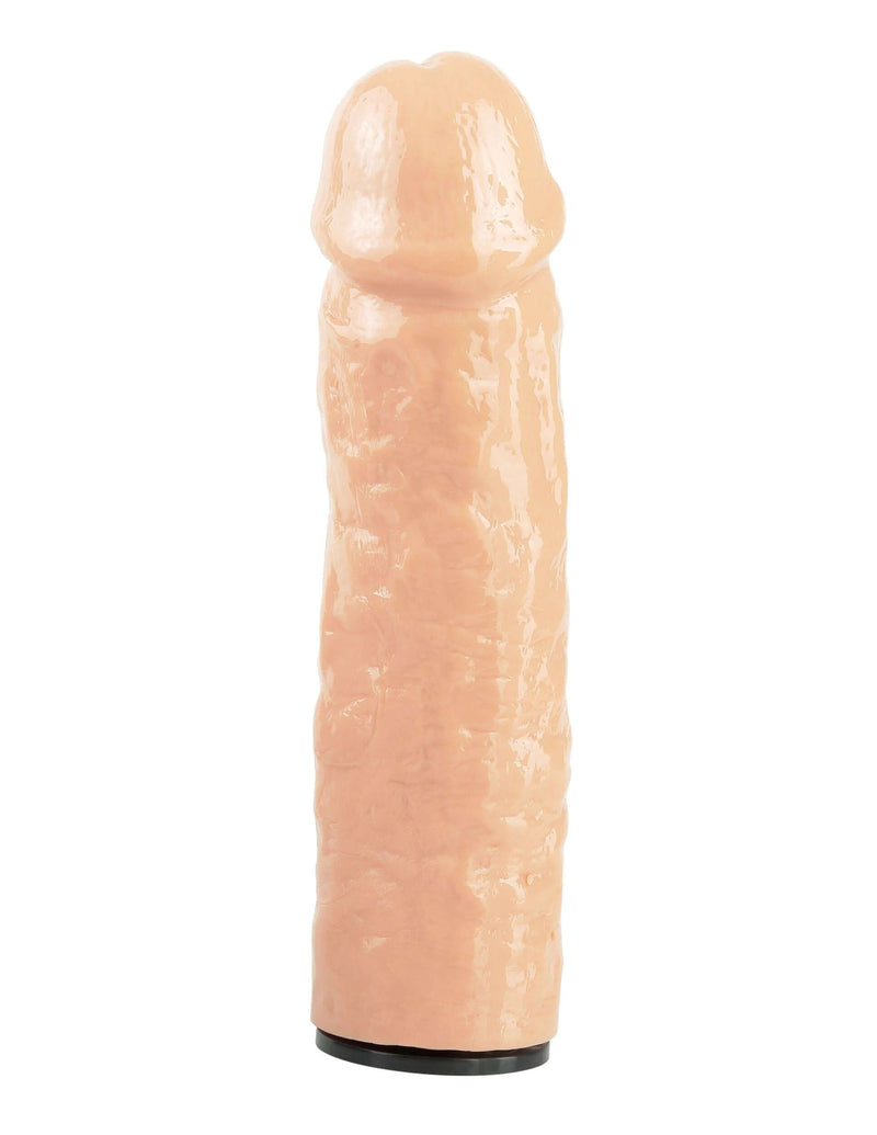 Realistic silicone dildo in flesh color, textured for enhanced stimulation, ideal for pleasure play.