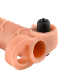 Close-up of the Fantasy X-Tensions Vibrating Real Feel 1 inch Extension showcasing its soft texture and integrated vibration button.