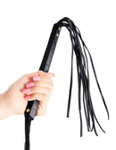 Hand holding the Fetish Fantasy Series Cat-O-Nine Tails Flogger Black, showcasing its sleek design and multiple tails.