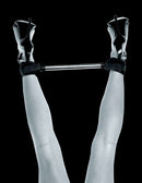 Fetish Fantasy Series Limited Edition Spreader Bar holding legs apart for comfortable restraint play.