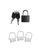 Black padlock with keys and three white security locks for chastity play.