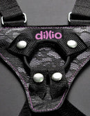 Close-up of Dillio 6 inches Strap On Suspenders Harness Set Pink featuring black lace design and logo.