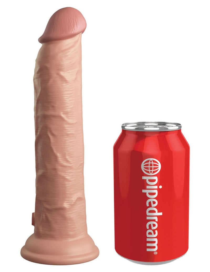 King Cock Elite 9 inches vibrating dildo next to a red Pipedream soda can for size comparison.